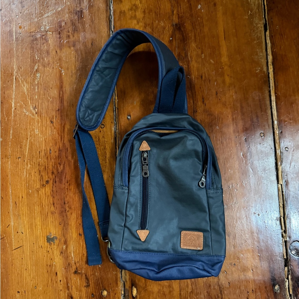 TSD brand Urban lightly coated canvas sling bag. Blue